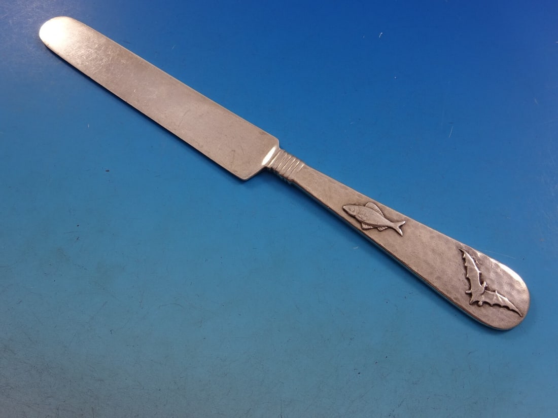 Shiebler 8 Inch Hammered Sterling Silver Tea Knife with Bat and Fish Design: Shiebler 8 Inch Hammered Sterling Silver Tea Knife with Bat and Fish Design This exquisite tea knife, crafted by Shiebler, features a stunning hammered and applied design in sterling silver. Measuring