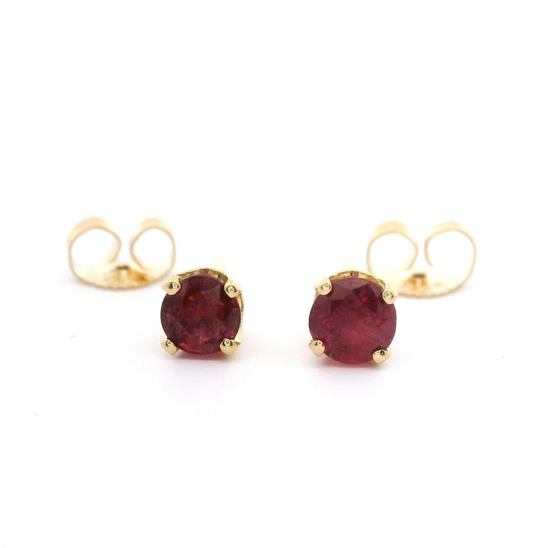 Stunning 14k Yellow Gold 0.65ctw Ruby Stud Earrings: Stunning 14k Yellow Gold 0.65ctw Ruby Stud Earrings Enhance your elegance with these stunning Classic 14k Yellow Gold Vivid Ruby Stud Earrings. Crafted from solid 14k yellow gold, these earrings featu