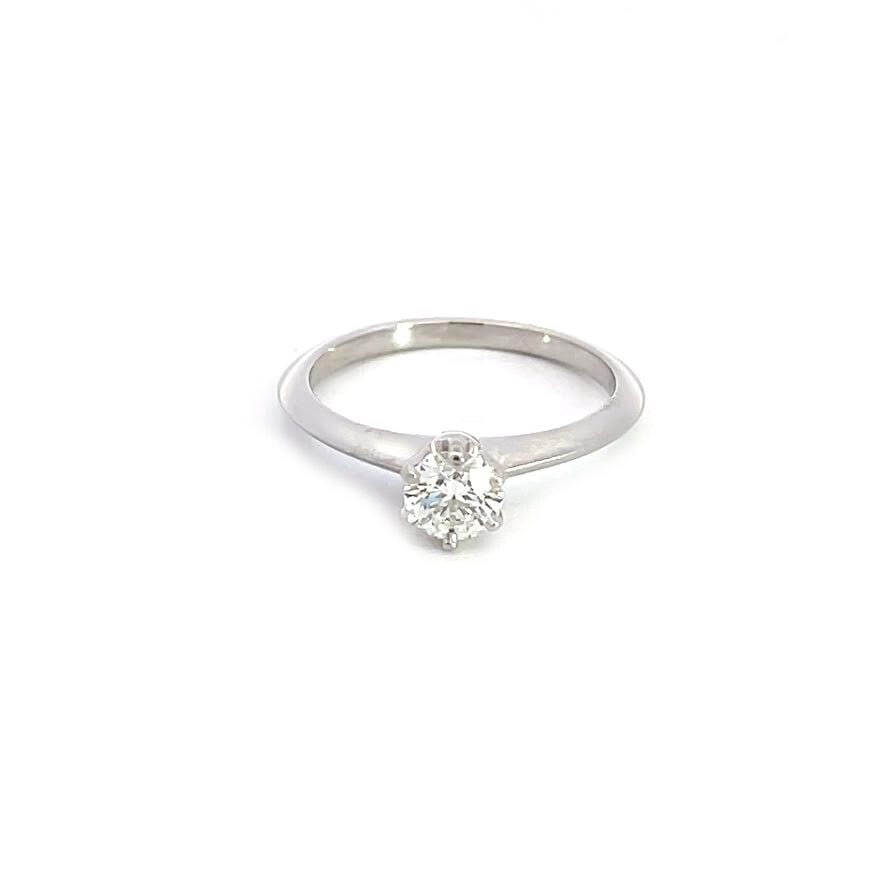 Tiffany & Co. 0.47ct Platinum Knife Edge Solitaire Ring Size 6: Tiffany & Co. 0.47ct Platinum Knife Edge Solitaire Ring Size 6 Presenting an exquisite solitaire ring from Tiffany & Co., this stunning piece is crafted from high-quality platinum with a polished fini