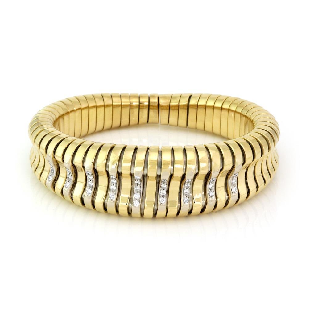 Stunning 18k Yellow Gold Tubogas Cuff Bracelet with 0.70ct Diamonds: Stunning 18k Yellow Gold Tubogas Cuff Bracelet with 0.70ct Diamonds Elevate your style with this stunning large cuff bracelet, expertly crafted from 18k yellow gold. The bracelet showcases a wide fron