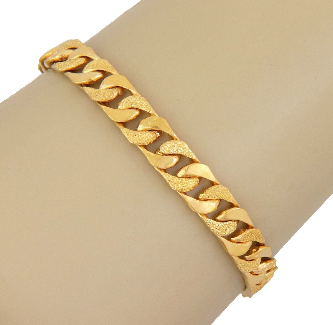 Cuban Link Bracelet 24k Gold with 18k Gold Clasp 8 Inches: Cuban Link Bracelet 24k Gold with 18k Gold Clasp 8 Inches Enhance your jewelry collection with this stunning Cuban Link Bracelet, expertly crafted from lustrous 24k yellow gold. Featuring a secure 18k
