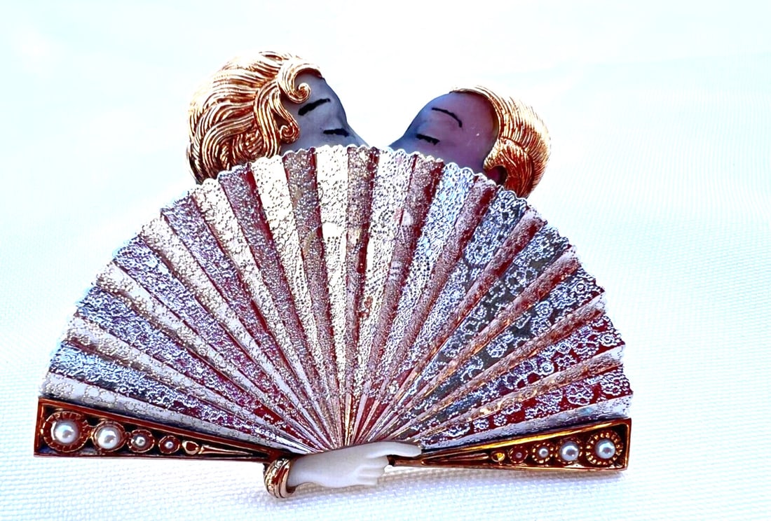 ERTE 14K Gold Sterling Silver Mother of Pearl Love's Screen Brooch: ERTE 14K Gold Sterling Silver Mother of Pearl Love's Screen Brooch This exquisite brooch features a stunning combination of 14K yellow gold and sterling silver, adorned with mother of pearl and pearl