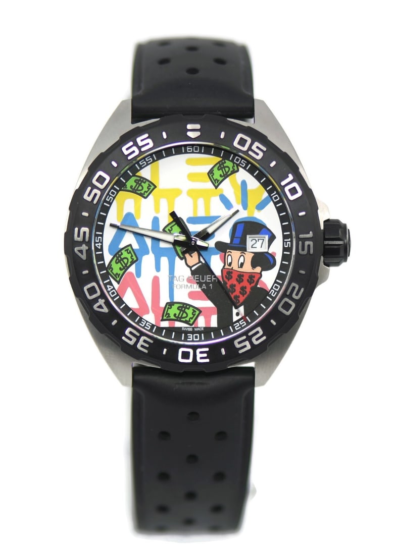 TAG Heuer Formula 1 Alec Monopoly Quartz Watch WAZ1119 with Box and Papers: TAG Heuer Formula 1 Alec Monopoly Quartz Watch WAZ1119 with Box and Papers Discover the TAG Heuer Formula 1 Alec Monopoly wristwatch, a perfect blend of style and precision. This sporty timepiece feat