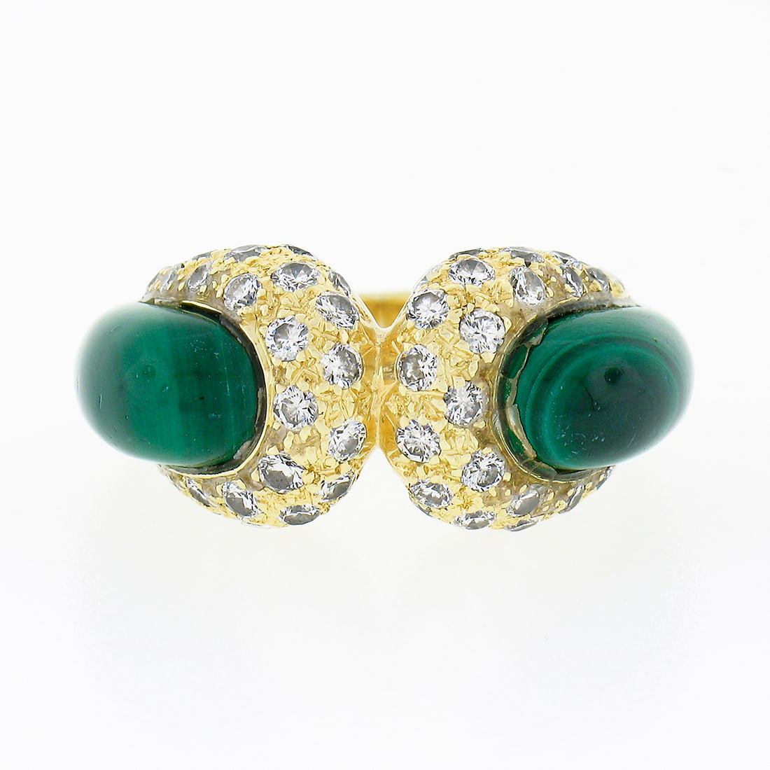 Vintage 18k Yellow Gold Statement Ring with Malachite and Diamond Accents: Vintage 18k Yellow Gold Statement Ring with Malachite and Diamond Accents This exquisite vintage statement ring features a stunning design crafted from solid 18k yellow gold. The ring is adorned with