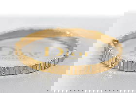 Christian Dior 18K Yellow Gold Diamond Bangle Bracelet Authentic: Christian Dior 18K Yellow Gold Diamond Bangle Bracelet Authentic This exquisite Christian Dior bracelet is a stunning piece crafted from 18K yellow gold, featuring a luxurious diamond centerpiece. Des