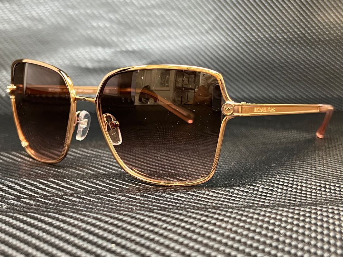 Michael Kors MK1087 Shiny Rose Gold Square Sunglasses with Case: Michael Kors MK1087 Shiny Rose Gold Square Sunglasses with Case Elevate your accessory game with these striking Michael Kors MK1087 sunglasses. Featuring a shiny rose gold square frame, these sunglass