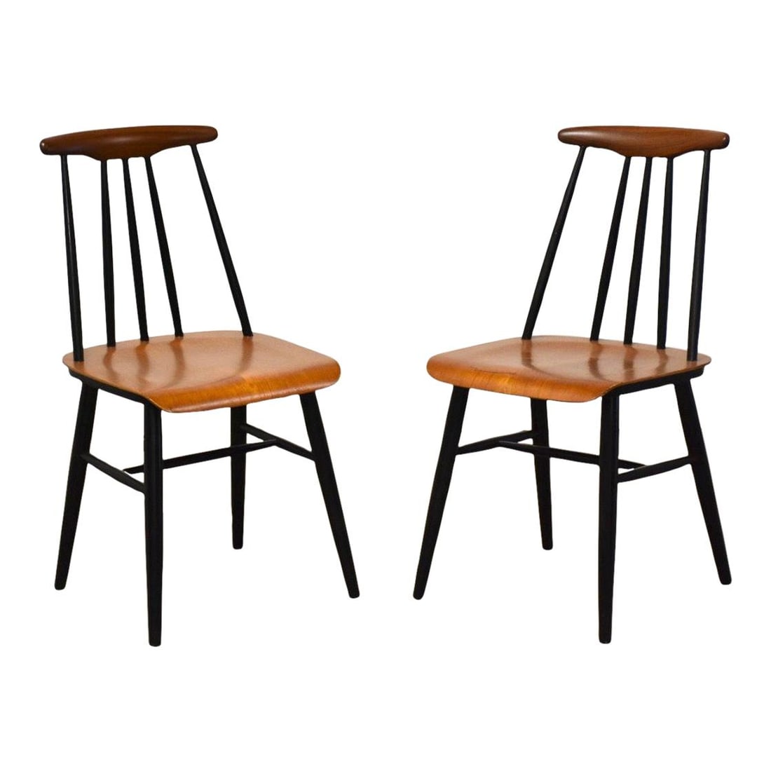 Mid Century Modern Teak Dining Chairs Pair Possibly by Ilmari Tapiovaara: Mid Century Modern Teak Dining Chairs Pair Possibly by Ilmari Tapiovaara This pair of mid-century modern dining chairs features an elegant design crafted from teak wood, showcasing the timeless appeal