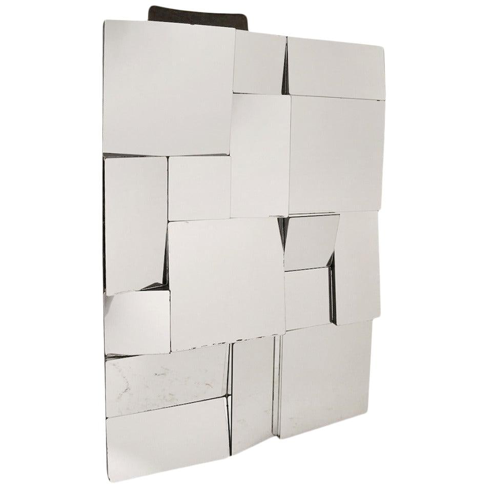 Neal Small Slopes Cubist Wall Mirror in Black Wood Frame: Neal Small Slopes Cubist Wall Mirror in Black Wood Frame This striking Neal Small Slopes Mirror features a Cubist-inspired design with a multi-plane surface that creates a unique visual effect. The cl