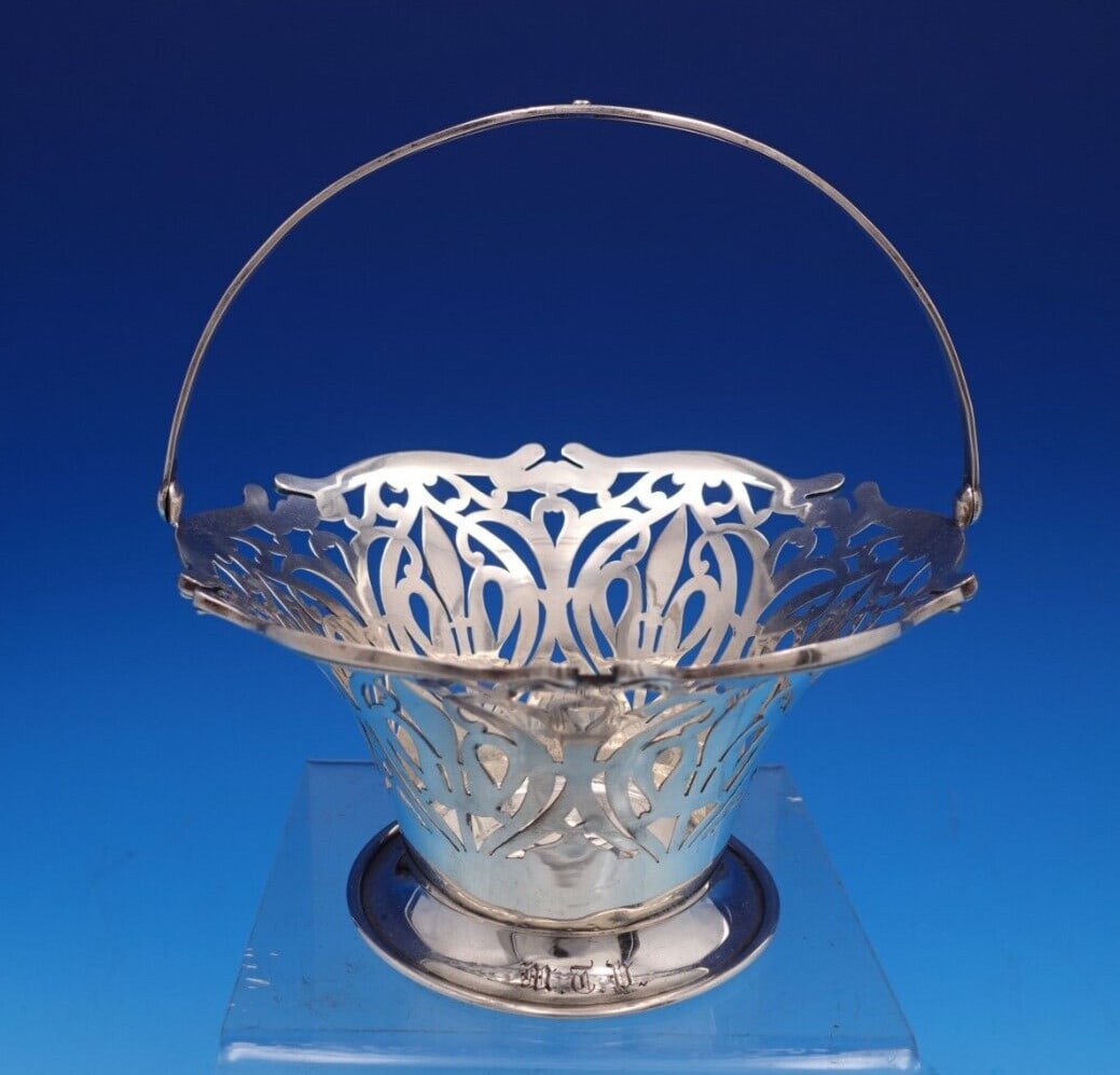 Frank Smith Sterling Silver Pierced Wine Coaster with Swing Handle: Frank Smith Sterling Silver Pierced Wine Coaster with Swing Handle Elevate your dining experience with this exquisite pierced wine coaster from Frank Smith. Crafted from high-quality sterling silver (