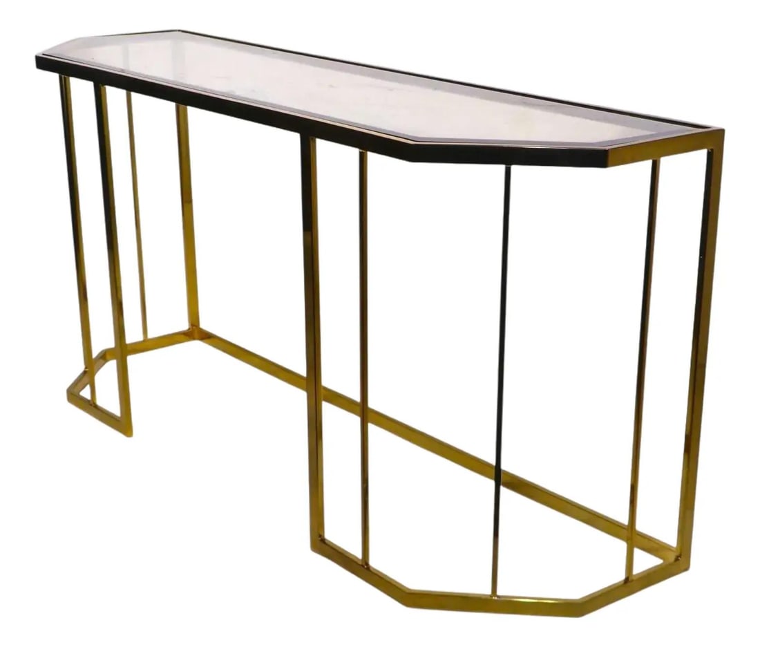 Chic Brass and Glass Console Table Hollywood Regency Style 1970s 1980s: Chic Brass and Glass Console Table Hollywood Regency Style 1970s 1980s This chic console table embodies the elegance of Hollywood Regency style, crafted circa 1970/80's. It features a striking six-sid