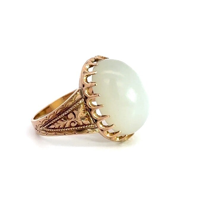 Victorian 10k Rosy Yellow Gold Moonstone Cabochon Engraved Ring: Victorian 10k Rosy Yellow Gold Moonstone Cabochon Engraved Ring Discover the exquisite charm of this Antique Victorian ring, crafted from 10k rosy yellow gold. This stunning piece features a natural c