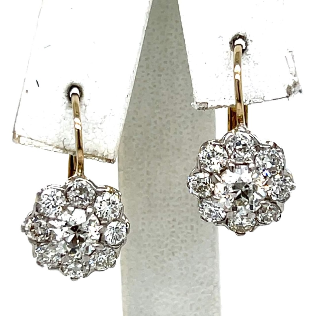 Platinum 18K Gold 2.60 Ct Diamond Earrings Old Mine European-cut: Platinum 18K Gold 2.60 Ct Diamond Earrings Old Mine European-cut Elevate your elegance with these stunning Platinum and 18K Yellow Gold earrings, featuring a total diamond weight of 2.60 carats. These