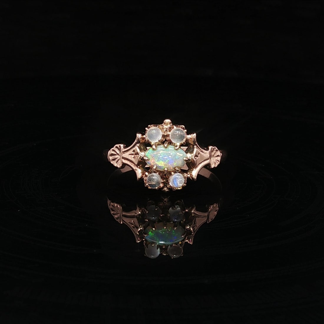 Antique Victorian 9k Yellow Gold Opal Moonstone Cocktail Ring: Antique Victorian 9k Yellow Gold Opal Moonstone Cocktail Ring This exquisite Antique Victorian ring showcases a beautiful combination of natural opal and moonstone stones, set in solid 9k yellow gold.