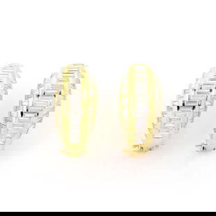 18k Yellow Gold 8 Carat Baguette Diamond Curved Huggie Earrings: 18k Yellow Gold 8 Carat Baguette Diamond Curved Huggie Earrings Elevate your elegance with these stunning 18k yellow gold huggie earrings. Designed in a fashionable wide curved shape, these earrings s