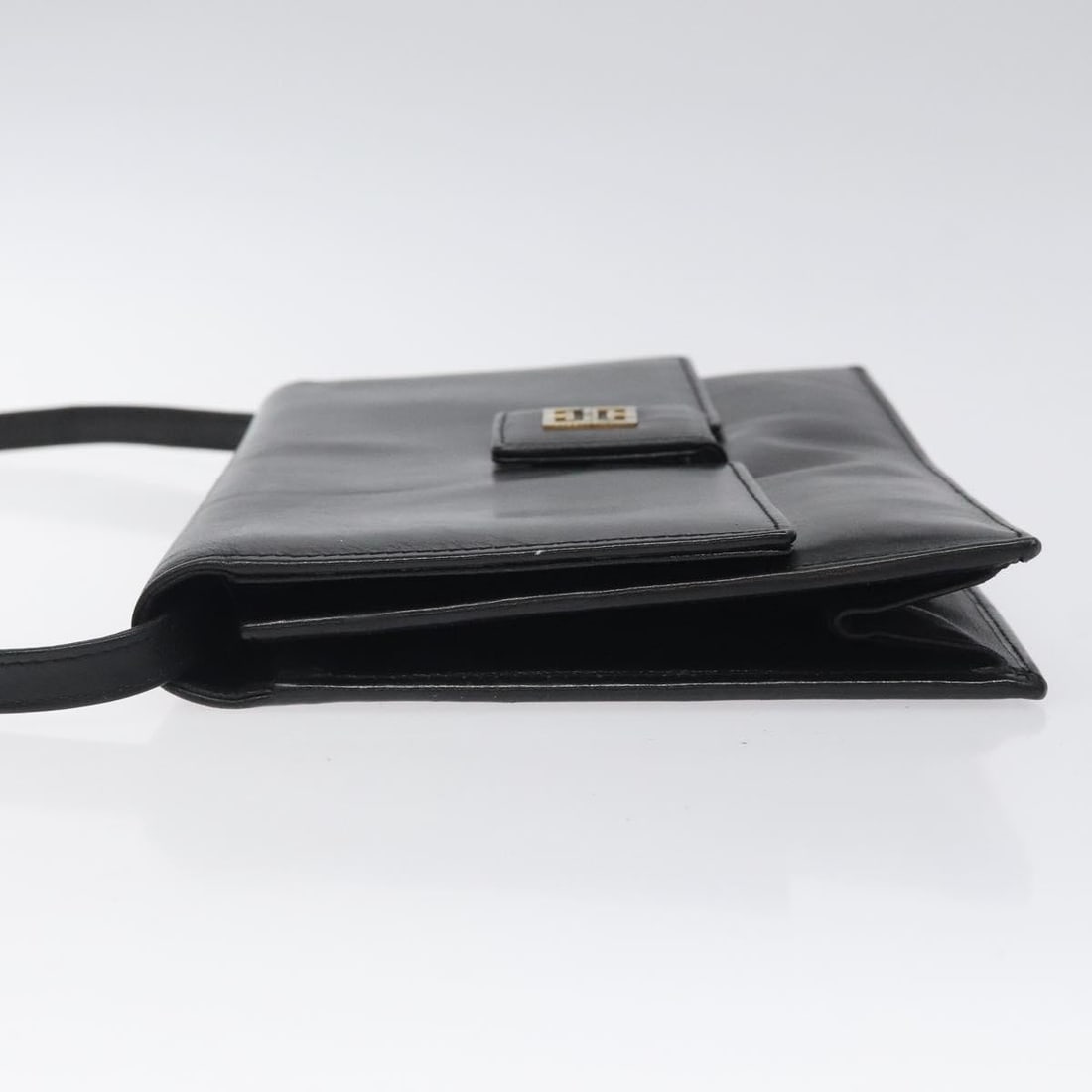 GIVENCHY Black Gold Leather Shoulder Bag Made in Spain: GIVENCHY Black Gold Leather Shoulder Bag Made in Spain This GIVENCHY shoulder bag combines elegance and functionality, crafted from high-quality leather in a striking black and gold color scheme. With