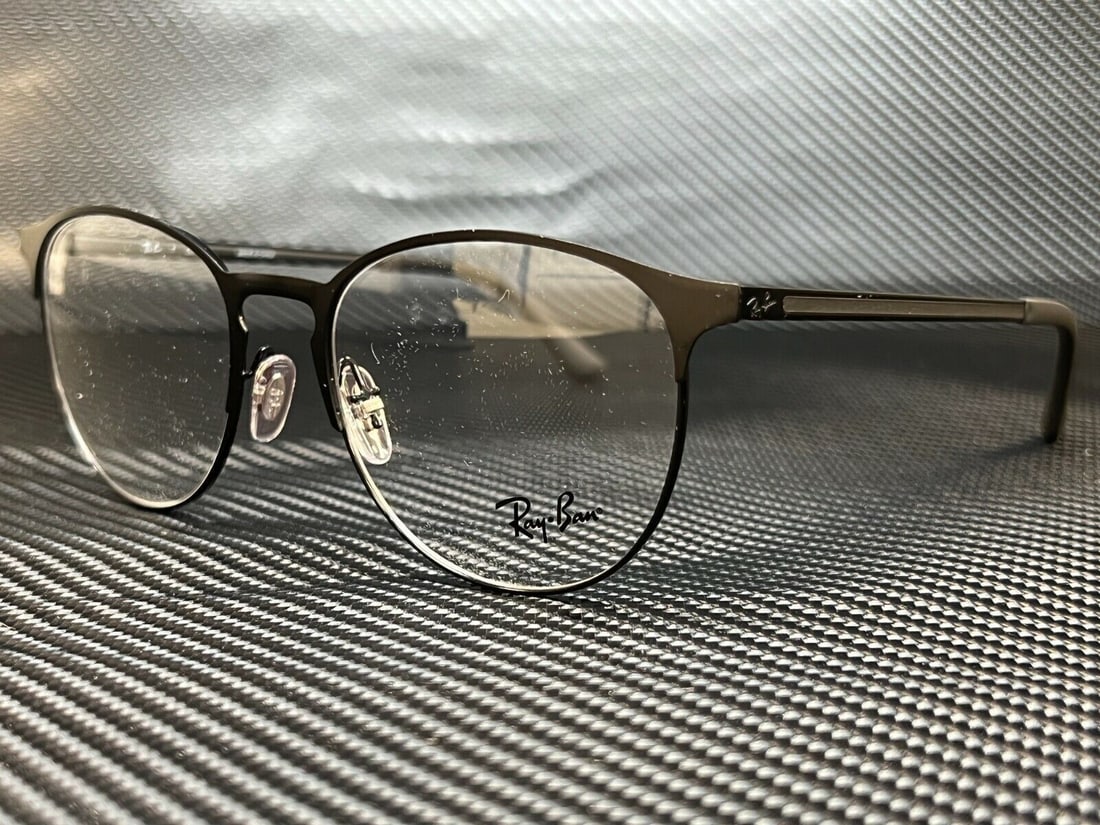 Ray-Ban RX6375 2944 Black Phantos Unisex Eyeglasses with Case: Ray-Ban RX6375 2944 Black Phantos Unisex Eyeglasses with Case Discover the stylish Ray-Ban RX6375 2944 Black Phantos Eyeglasses, designed for unisex wear. Featuring a sleek black frame, these eyeglass