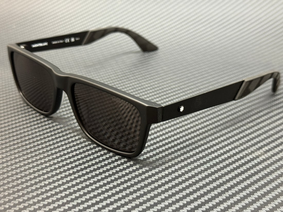 Montblanc MB0299S 005 Matte Black Grey Sunglasses with Case and Authenticity: Montblanc MB0299S 005 Matte Black Grey Sunglasses with Case and Authenticity Elevate your style with Montblanc MB0299S 005 sunglasses, designed for the modern man. Featuring a sleek matte black frame