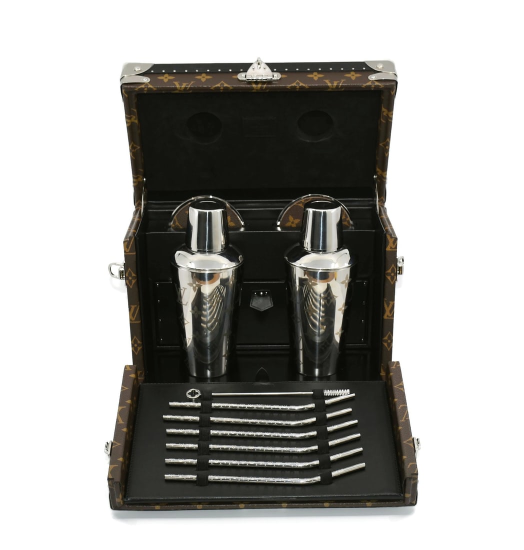 Louis Vuitton Cocktail Trunk Case M10019 with 2 Shakers 6 Coasters 6 Straws: Louis Vuitton Cocktail Trunk Case M10019 with 2 Shakers 6 Coasters 6 Straws Introducing the Louis Vuitton Cocktail Trunk Case (Ref: M10019), a luxurious addition to your entertaining collection. This