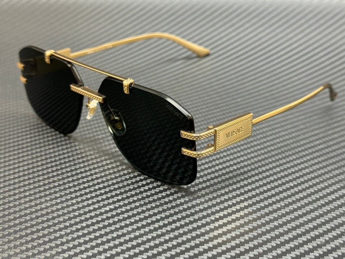 Versace VE2275 100287 Gold Frame Green Lenses Sunglasses: Versace VE2275 100287 Gold Frame Green Lenses Sunglasses Elevate your style with these VERSACE VE2275 sunglasses, featuring a stunning gold frame that exudes luxury. The green lenses provide a strikin