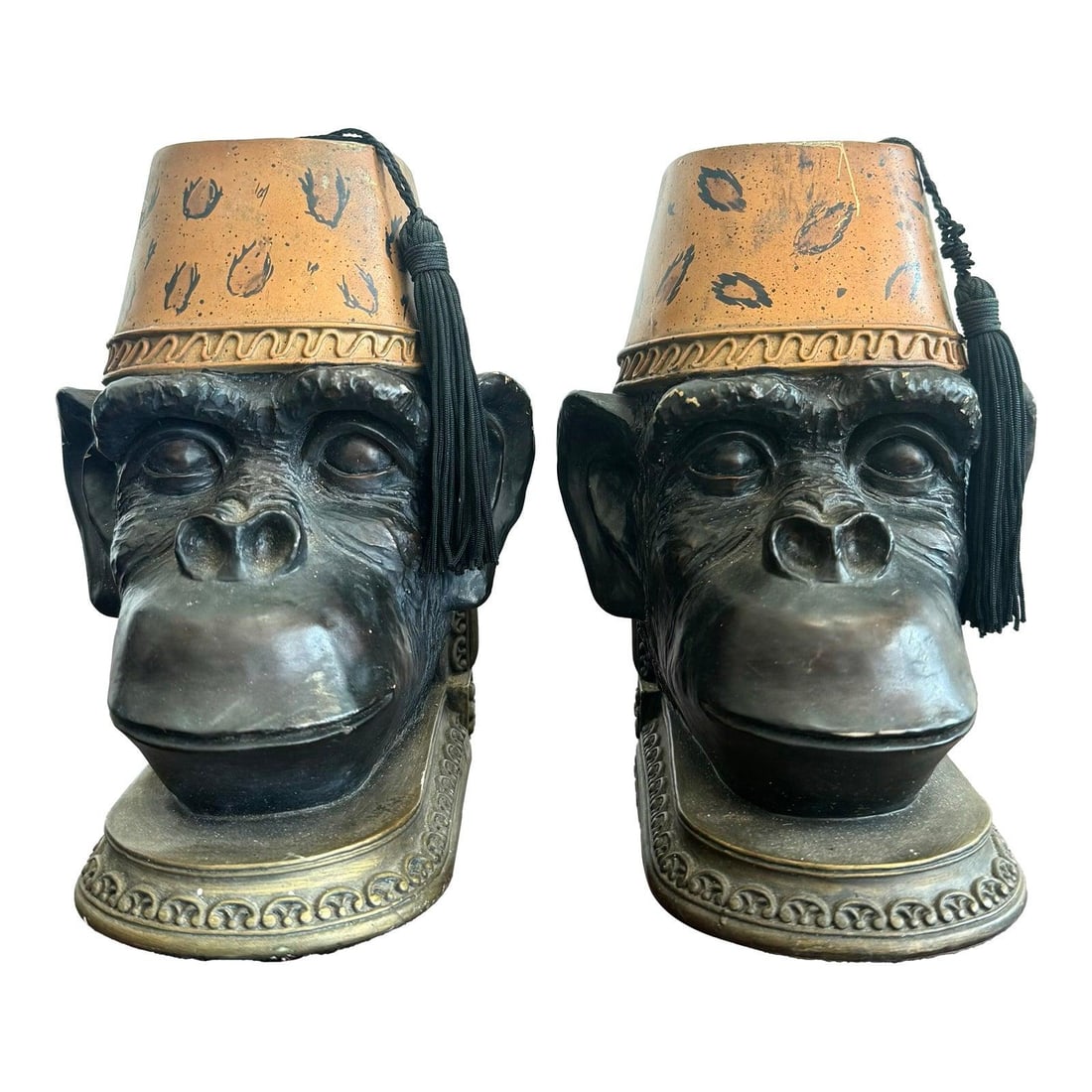 Whimsical Bronze Monkey Head Bookends with Fez Hats - Set of 2: Whimsical Bronze Monkey Head Bookends with Fez Hats - Set of 2 Add a touch of whimsical charm to your space with this pair of late 20th century sculptural bookends featuring detailed monkey heads ador