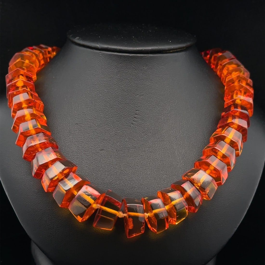 Estate Amber Graduated Bead Necklace with Screw Clasp: Estate Amber Graduated Bead Necklace with Screw Clasp This stunning necklace features a unique design with graduated hexagonal amber beads, showcasing their natural orange color. Perfect for adding a