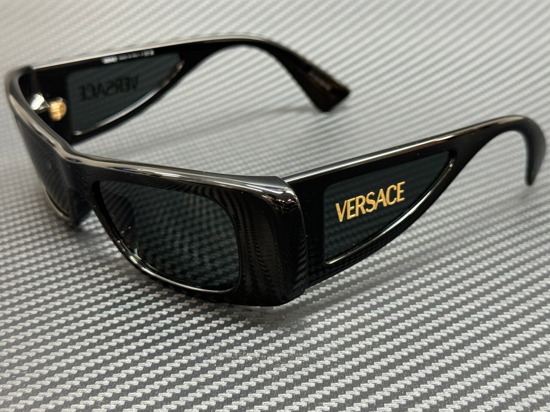 VERSACE VE4481 GB1 87 Black Grey Women's Sunglasses with Authenticity: VERSACE VE4481 GB1 87 Black Grey Women's Sunglasses with Authenticity Elevate your style with these VERSACE VE4481 GB1 87 sunglasses. Featuring a sleek black frame and grey lenses, these sunglasses ar