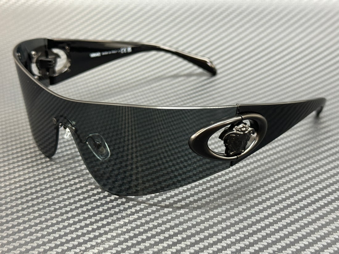 Versace VE2280 143687 Dark Grey 70mm Sunglasses with Authenticity Certificate: Versace VE2280 143687 Dark Grey 70mm Sunglasses with Authenticity Certificate Elevate your style with the VERSACE VE2280 143687 Sunglasses, designed for the modern man. Featuring a sleek dark grey fra