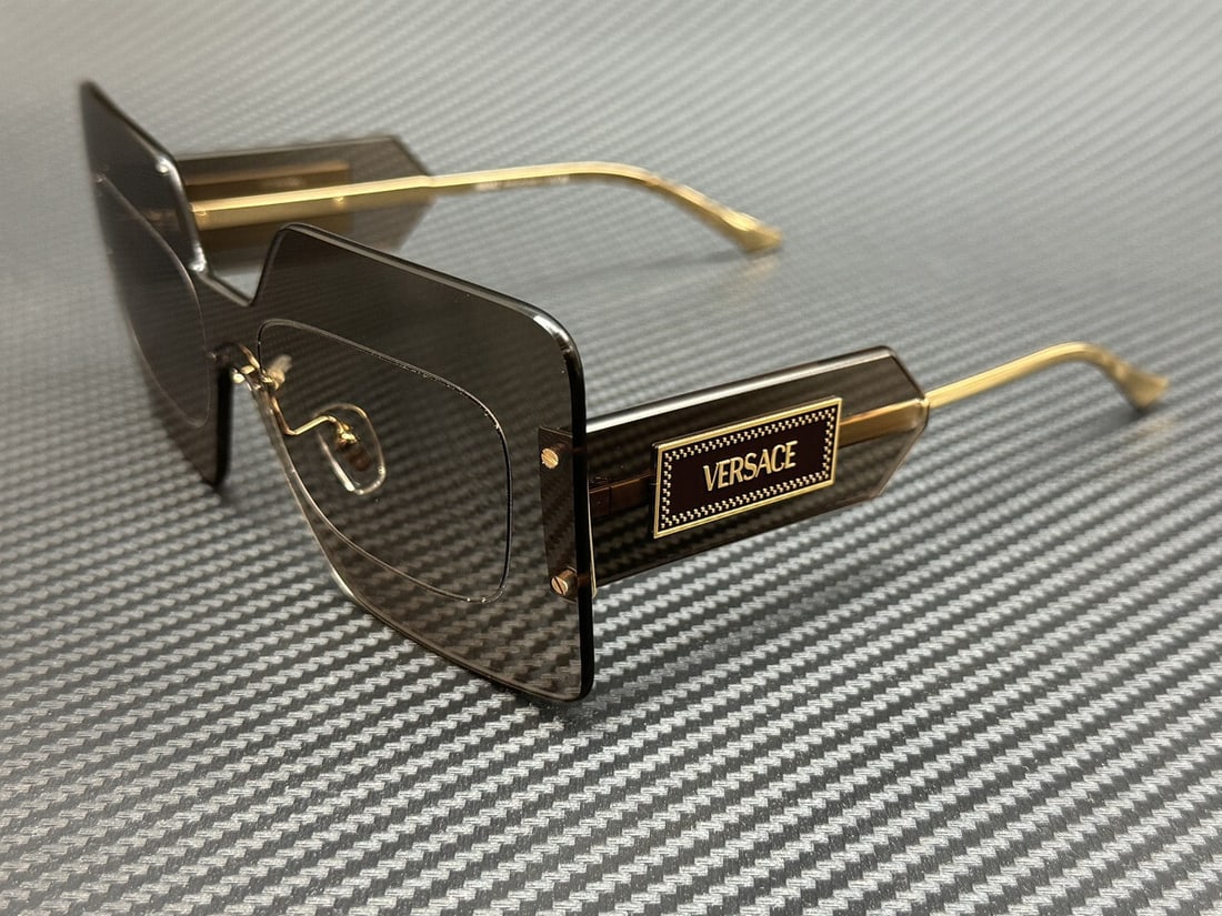 Versace VE2277 10026I Grey Mirror Silver Women's Sunglasses 70mm: Versace VE2277 10026I Grey Mirror Silver Women's Sunglasses 70mm Elevate your accessory collection with these stunning Versace VE2277 sunglasses. Featuring a sophisticated grey mirror silver frame and