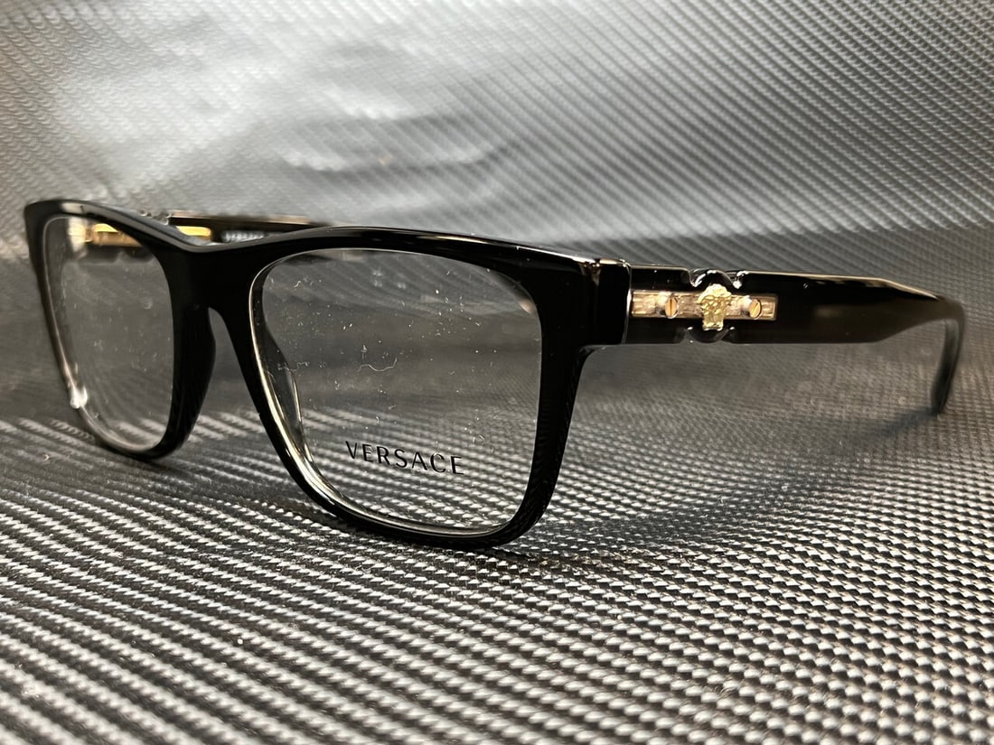Versace VE3303 GB1 Black 57mm Men's Eyeglasses with Clear Lenses: Versace VE3303 GB1 Black 57mm Men's Eyeglasses with Clear Lenses Elevate your eyewear collection with these stylish Versace VE3303 GB1 men's eyeglasses. Featuring a sleek black frame, these eyeglasses