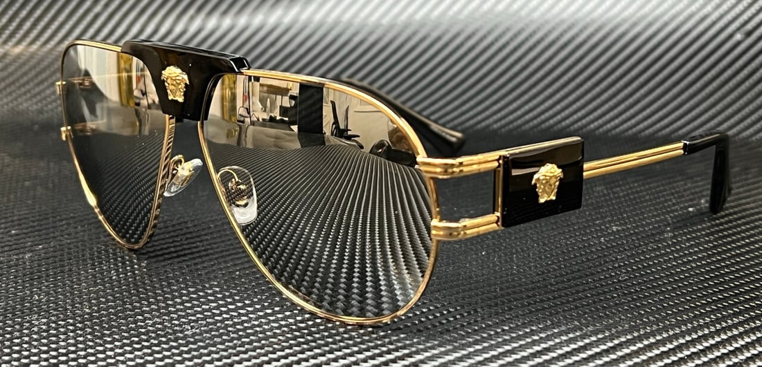 Versace VE2252 10026G Gold Frame Grey Mirror Aviator Sunglasses: Versace VE2252 10026G Gold Frame Grey Mirror Aviator Sunglasses Elevate your style with these Versace VE2252 sunglasses, featuring a luxurious gold frame paired with stunning gray mirrored lenses. Des