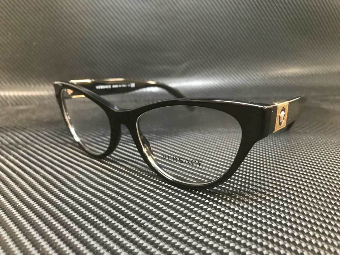 Versace VE3296 GB1 Black Cat Eye Women's Eyeglasses with Authenticity Certificate: Versace VE3296 GB1 Black Cat Eye Women's Eyeglasses with Authenticity Certificate Introducing the Versace VE3296 GB1 eyeglasses, a stunning pair that combines elegance and modern style. These cat eye