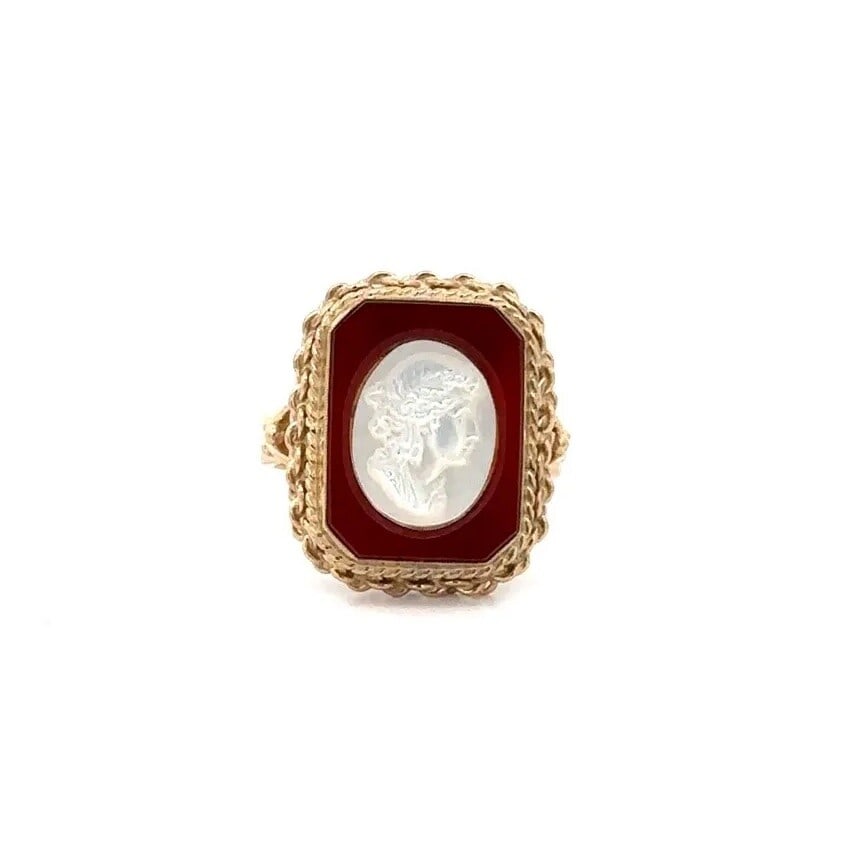 14k Yellow Gold Mother of Pearl Cameo Carnelian Cocktail Ring: 14k Yellow Gold Mother of Pearl Cameo Carnelian Cocktail Ring This exquisite cocktail ring showcases a stunning 14k yellow gold setting featuring a beautiful mother of pearl cameo inlay complemented b