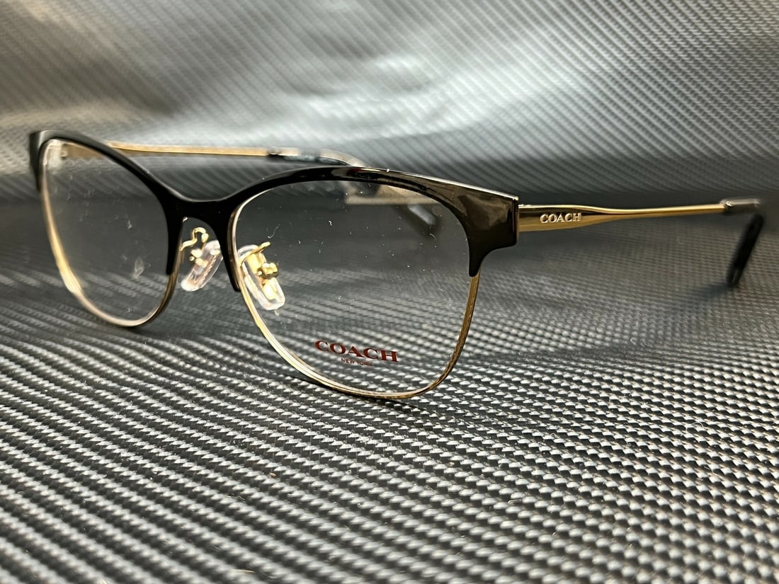 Coach HC5111 9346 Black Light Gold Cat Eye Eyeglasses with Case: Coach HC5111 9346 Black Light Gold Cat Eye Eyeglasses with Case Elevate your eyewear collection with these stylish Coach HC5111 9346 Cat Eye eyeglasses. Featuring a sleek black frame with light gold a