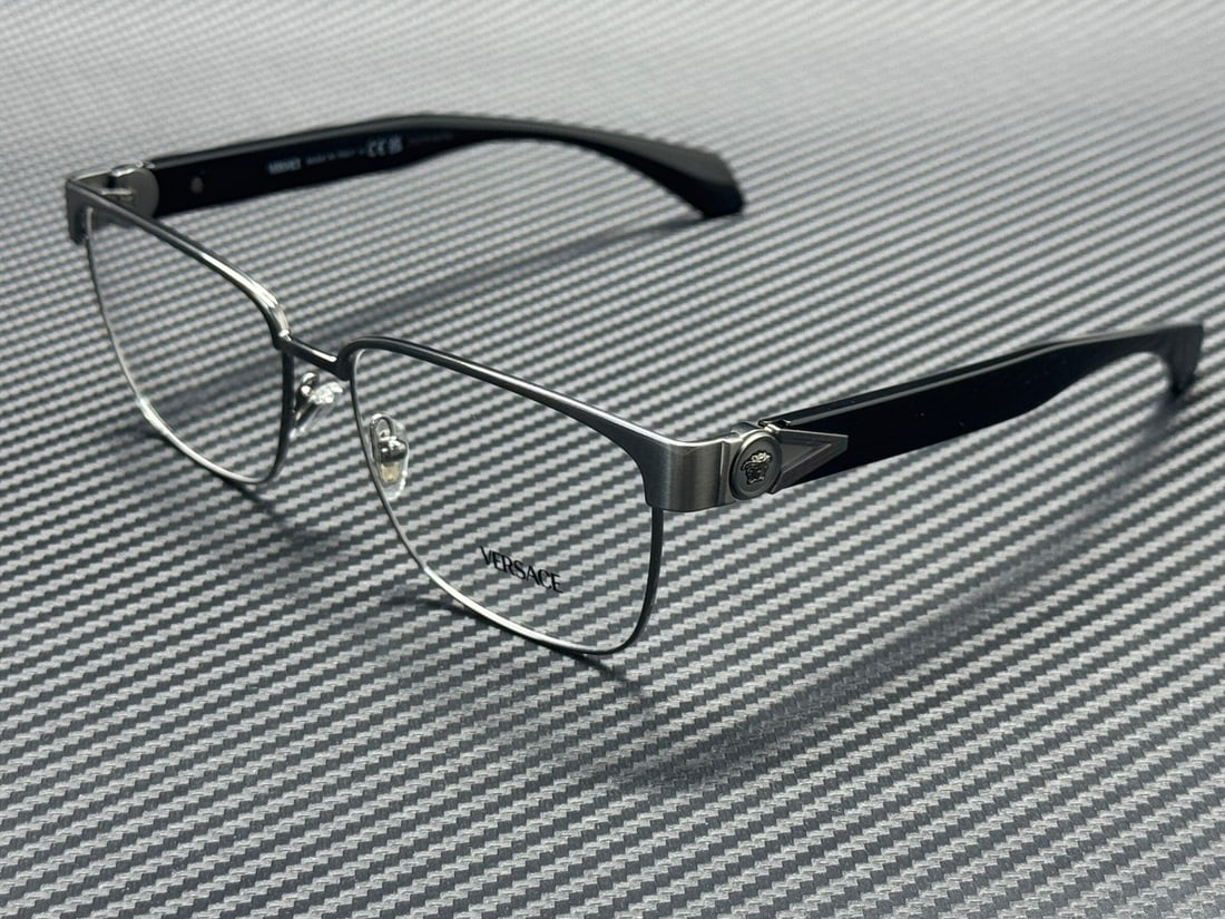 Versace VE1306 1262 Brushed Gunmetal 57mm Eyeglasses with Case: Versace VE1306 1262 Brushed Gunmetal 57mm Eyeglasses with Case Discover the elegance of Versace with these men's eyeglasses, model VE1306 1262. Featuring a sophisticated brushed gunmetal frame, these