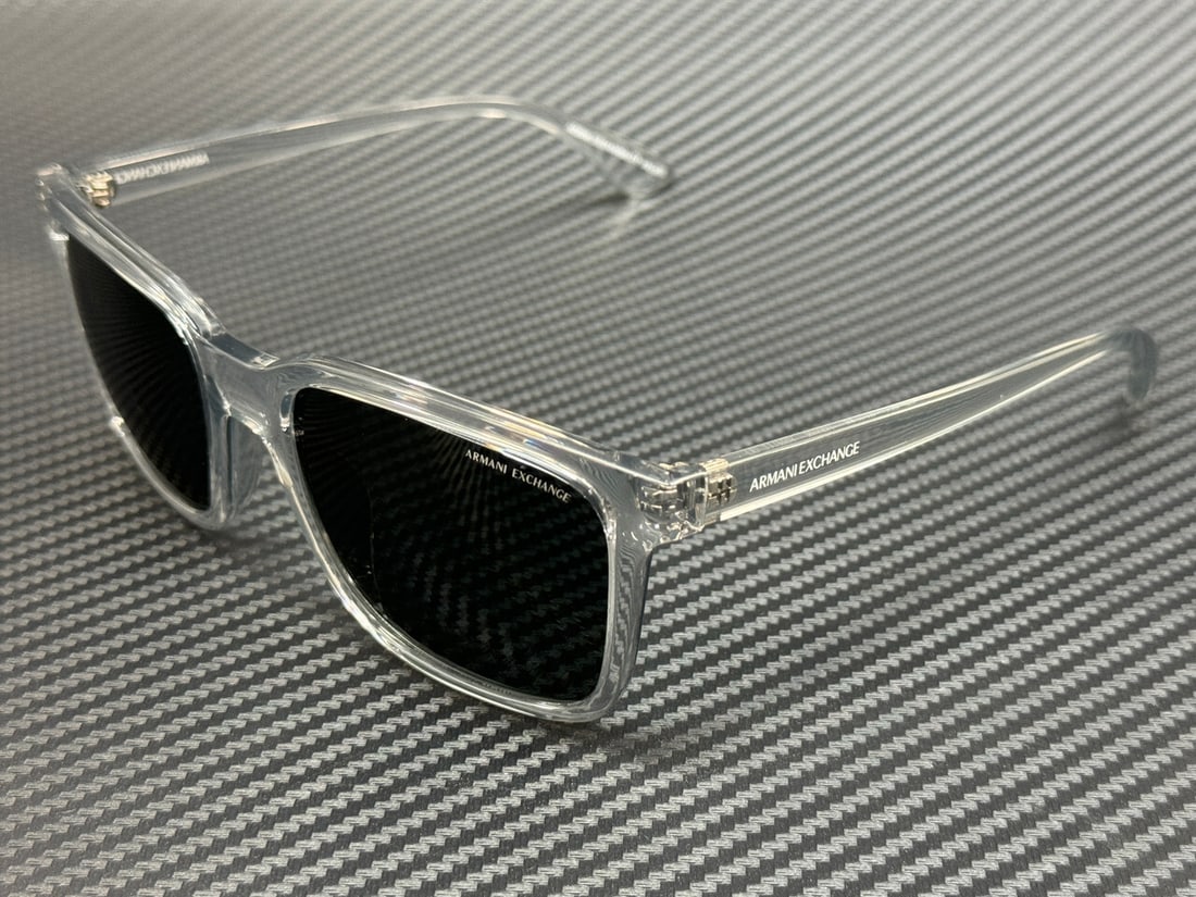 Armani Exchange AX4112SU 823987 Transparent Grey Men's Sunglasses: Armani Exchange AX4112SU 823987 Transparent Grey Men's Sunglasses Discover the sophistication of Armani Exchange with these AX4112SU 823987 sunglasses. Featuring a stylish transparent grey frame that