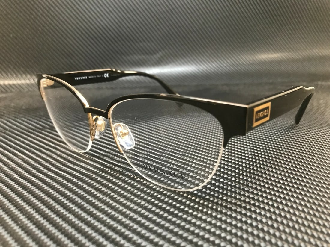 Versace VE1265 1433 Black Gold Cat Eye Eyeglasses with Demo Lens: Versace VE1265 1433 Black Gold Cat Eye Eyeglasses with Demo Lens Elevate your eyewear collection with these stunning Versace VE1265 1433 Cat Eye Eyeglasses. Crafted in Italy, these stylish glasses fea