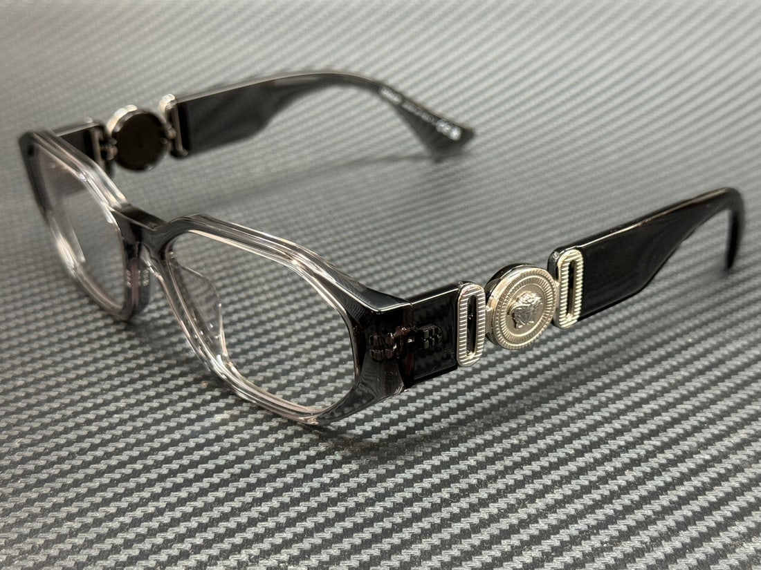 Versace VE3320U 593 Grey Transparent Men's Eyeglasses with Authenticity Certificate: Versace VE3320U 593 Grey Transparent Men's Eyeglasses with Authenticity Certificate Discover the elegance of Versace with these stylish VE3320U 593 eyeglasses. Featuring a chic grey transparent frame,