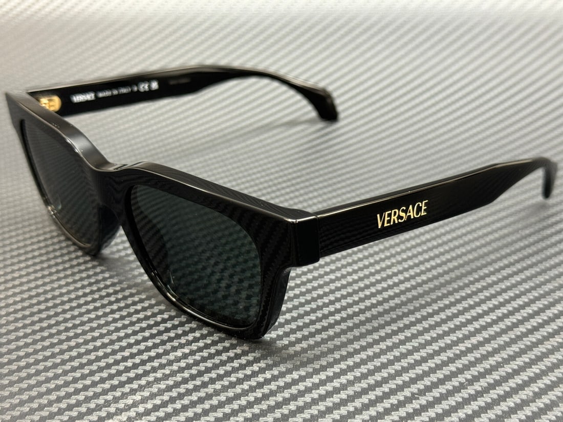 Versace VE4486 GB1 87 Black Grey 52mm Men's Sunglasses with Authenticity Certificate: Versace VE4486 GB1 87 Black Grey 52mm Men's Sunglasses with Authenticity Certificate Elevate your eyewear collection with these Versace VE4486 sunglasses, featuring a sleek black frame complemented by