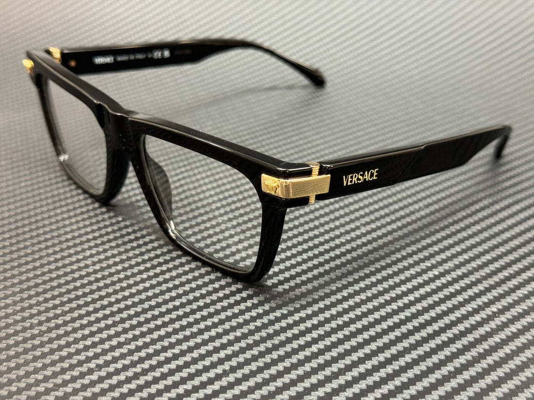 Versace VE3354 GB1 Black Eyeglasses with Authenticity Certificate: Versace VE3354 GB1 Black Eyeglasses with Authenticity Certificate Experience luxury and style with the Versace VE3354 GB1 eyeglasses, designed for men. These eyeglasses feature a sleek black frame and