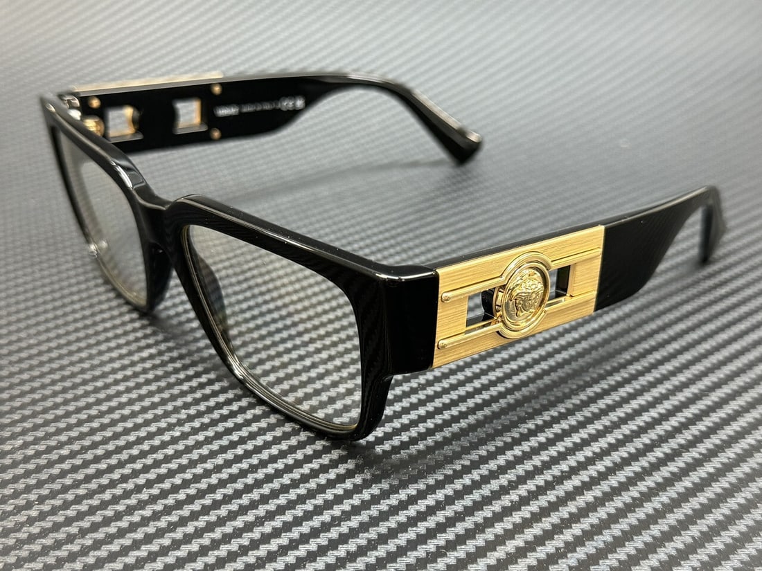 Versace VE3350F GB1 Black Gold Men's Eyeglasses with Accessories: Versace VE3350F GB1 Black Gold Men's Eyeglasses with Accessories Introducing the Versace VE3350F GB1 eyeglasses, a sophisticated accessory for the modern man. These stylish eyeglasses feature a sleek