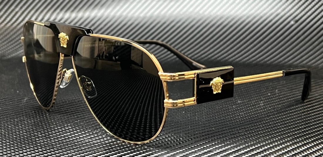 Versace VE2252 Gold Aviator Sunglasses with Dark Grey Lenses: Versace VE2252 Gold Aviator Sunglasses with Dark Grey Lenses Elevate your eyewear collection with these stylish Versace VE2252 sunglasses. Featuring a striking gold frame complemented by dark grey len