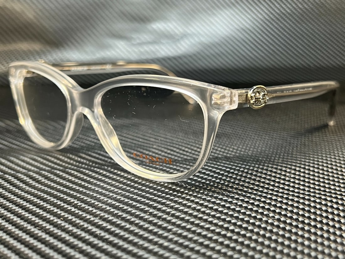 Coach HC6155 5614 Grey Women's Eyeglasses with Clear Lenses: Coach HC6155 5614 Grey Women's Eyeglasses with Clear Lenses Elevate your style with these Coach HC6155 5614 women's eyeglasses, featuring a sleek grey frame. Designed for comfort and sophistication, t