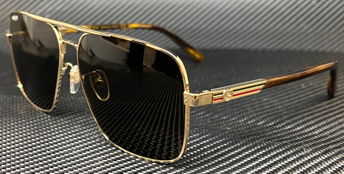 GUCCI GG1289S 002 Gold Brown Extra Large Men's Sunglasses with Authenticity: GUCCI GG1289S 002 Gold Brown Extra Large Men's Sunglasses with Authenticity Elevate your style with these GUCCI GG1289S 002 sunglasses, featuring a luxurious gold frame complemented by rich brown lens