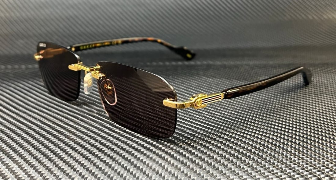 Gucci GG1221S 002 Gold Havana Aviator Sunglasses with Brown Lenses: Gucci GG1221S 002 Gold Havana Aviator Sunglasses with Brown Lenses Elevate your eyewear collection with these Gucci GG1221S 002 sunglasses. Featuring a stylish aviator design, these rimless sunglasses