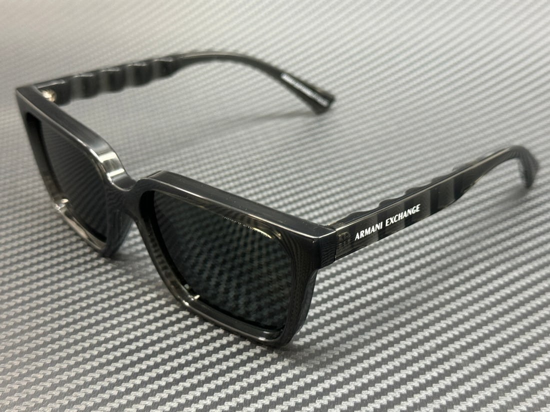 Armani Exchange AX4147S 835687 Transparent Grey 56mm Sunglasses with Box and Certificate: Armani Exchange AX4147S 835687 Transparent Grey 56mm Sunglasses with Box and Certificate Stylishly crafted for the modern man, these Armani Exchange AX4147S sunglasses feature a transparent grey frame