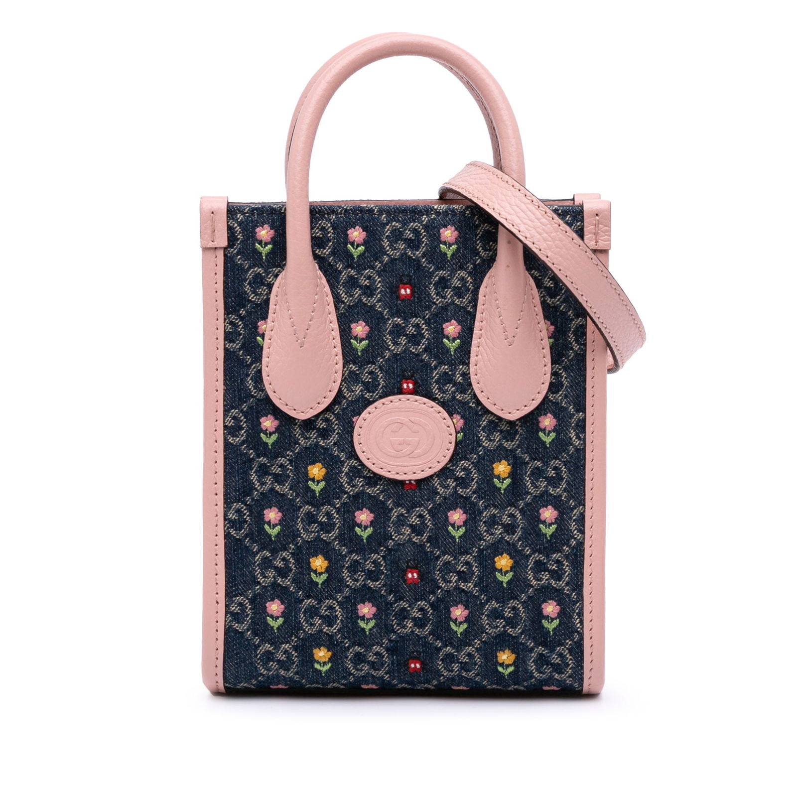 Gucci Mini GG Denim Tote with Embroidered Flowers and Leather Trim: Gucci Mini GG Denim Tote with Embroidered Flowers and Leather Trim This stylish Gucci Mini GG Denim Interlocking G Flowers Tote showcases a unique embroidered denim body complemented by leather trim.