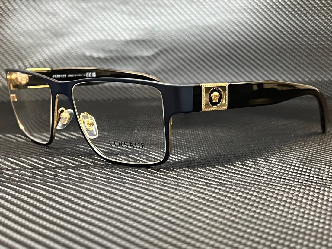 Versace VE1274 1468 Blue Rectangular Eyeglasses with Clear Lenses: Versace VE1274 1468 Blue Rectangular Eyeglasses with Clear Lenses Discover the elegance of Versace VE1274 1468 eyeglasses, designed for the modern man. These stylish rectangular frames are crafted fro