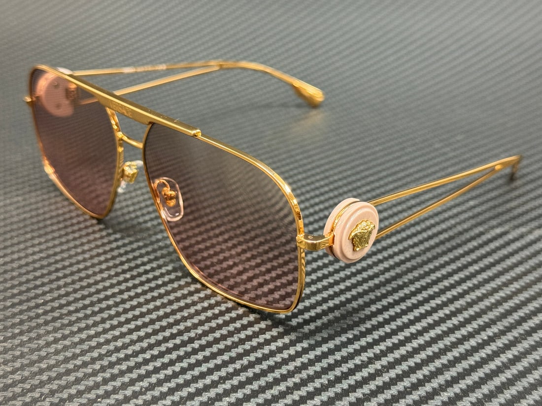 Versace VE2269 10027E Gold Frame Pink Gradient Sunglasses 62mm: Versace VE2269 10027E Gold Frame Pink Gradient Sunglasses 62mm Elevate your style with these Versace VE2269 sunglasses, designed for the modern man. Featuring a luxurious gold frame complemented by st
