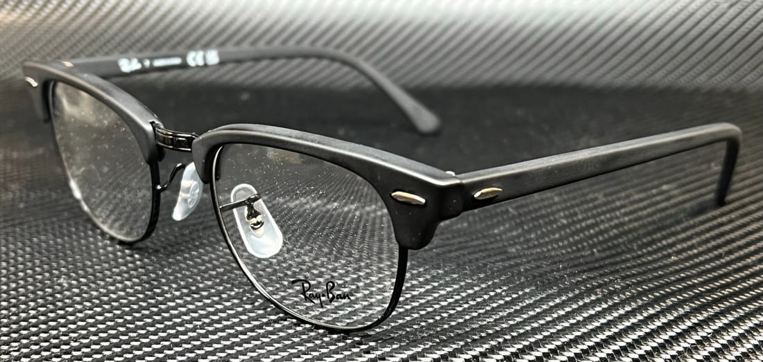 Ray-Ban RX5154 2077 Matte Black Clubmaster Eyeglasses with Case: Ray-Ban RX5154 2077 Matte Black Clubmaster Eyeglasses with Case Experience timeless style with the Ray-Ban RX5154 2077 Matte Black Clubmaster Unisex Eyeglasses. These eyeglasses feature a square desig