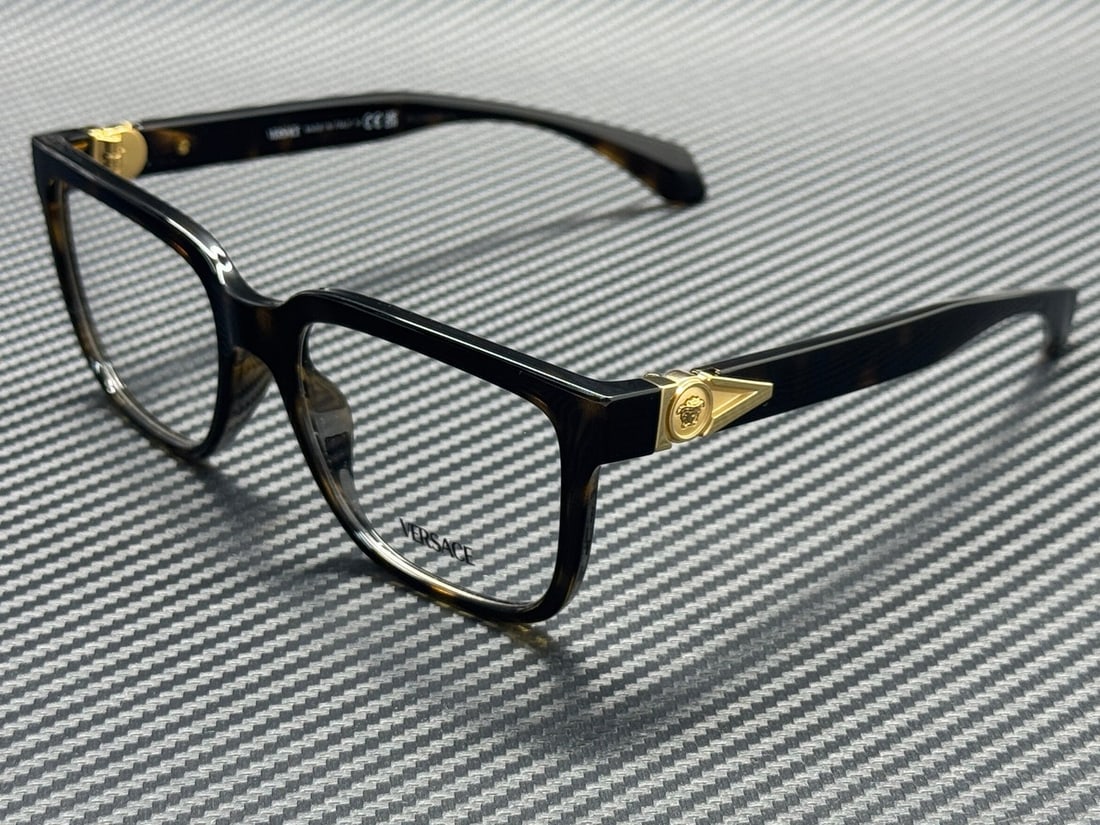 Versace VE3377U 108 Havana 55mm Men's Eyeglasses with Case: Versace VE3377U 108 Havana 55mm Men's Eyeglasses with Case Introducing the Versace VE3377U 108 Havana Men's Eyeglasses, a stylish blend of luxury and functionality. Crafted by the renowned brand Versa